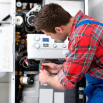 a man repairing a hot water system