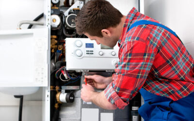 a man repairing a hot water system