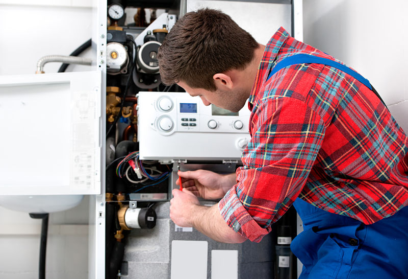 a man repairing a hot water system